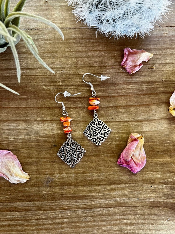 Orange spiny dangle earrings